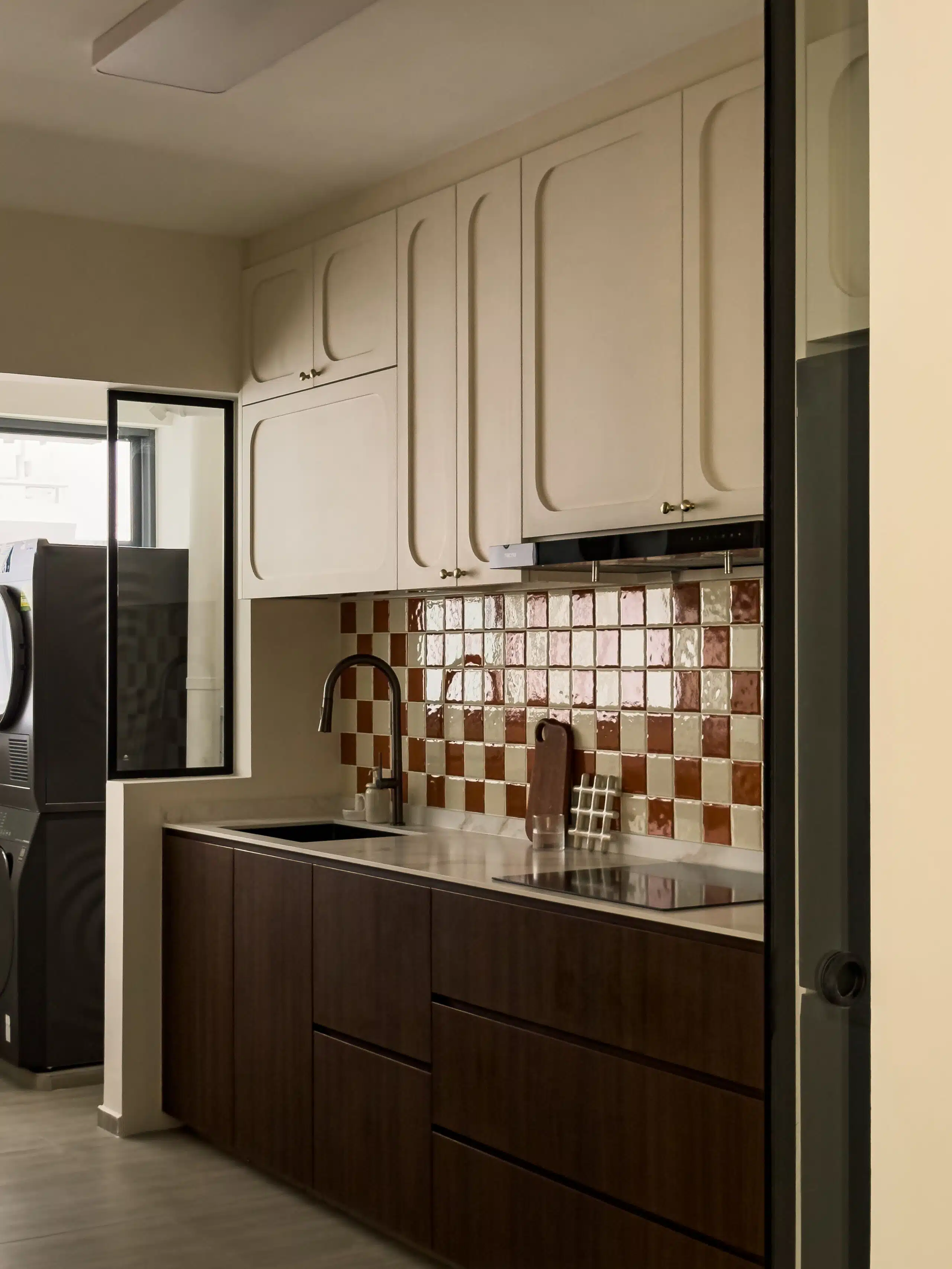 Mid Century Kitchen cabinets with curved framed doors and ivory checkered tiles as backsplash